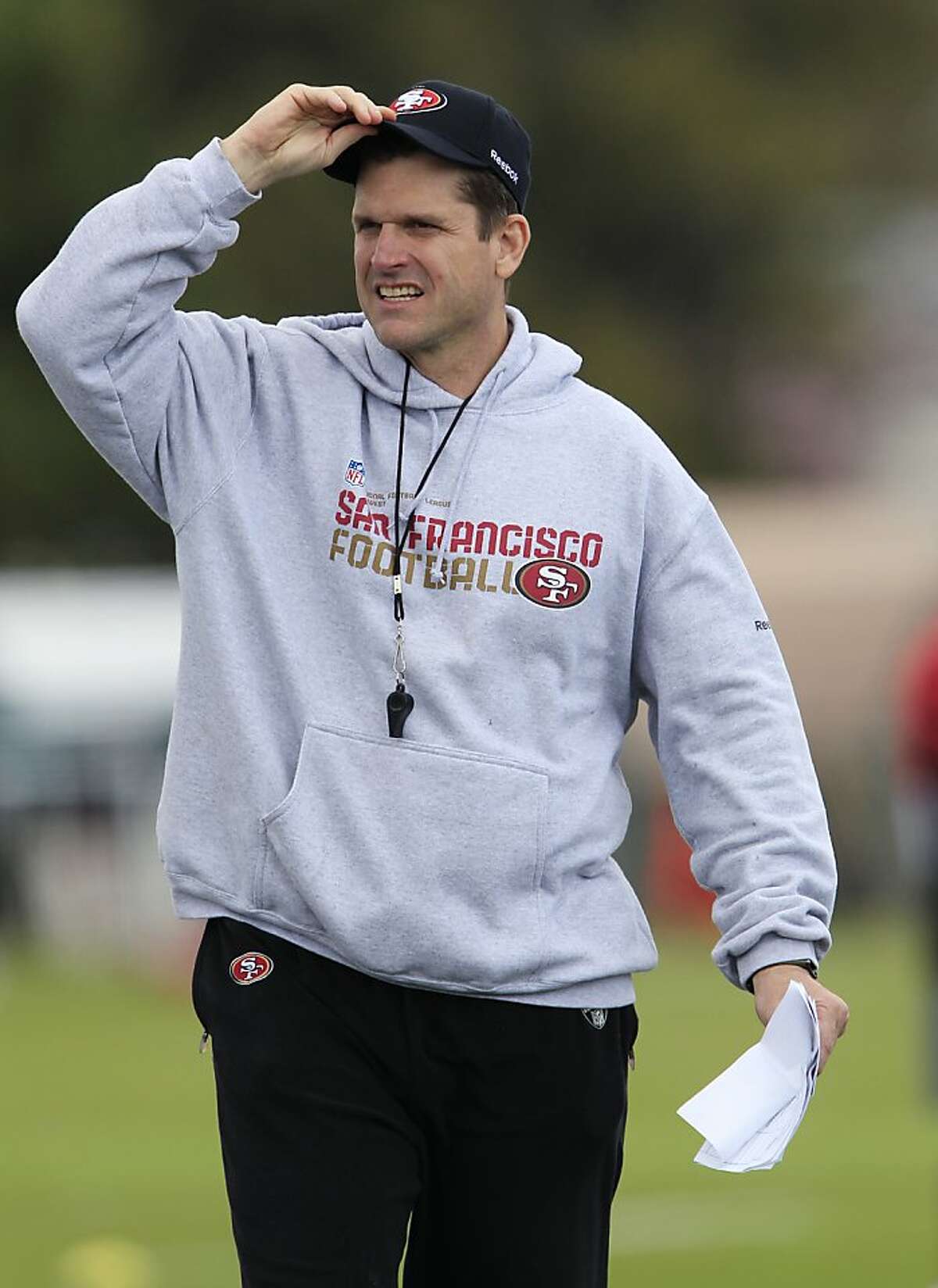 San Francisco head coach Jim Harbaugh watches the 49ers' local pro day at the team's training facility in Santa Clara, Calif., Wednesday, April 20, 2011.