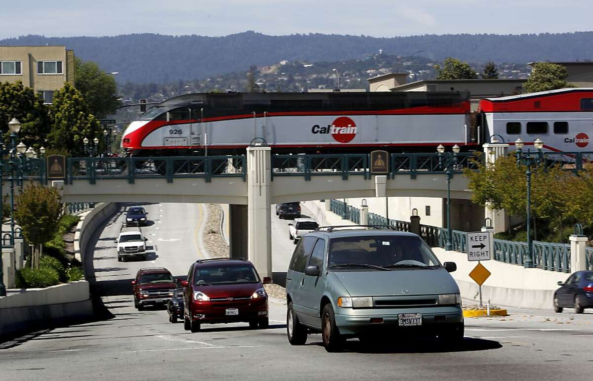 A CalTrain crosses Jefferson Avenue in Redwood City, Calif. on Wednesday April 29, 2009, as a battle is shaping up on the Peninsula over high-speed rail service through the Silicon Valley with residents and cities favoring a system that runs through a tunnel or along a sunken trench.