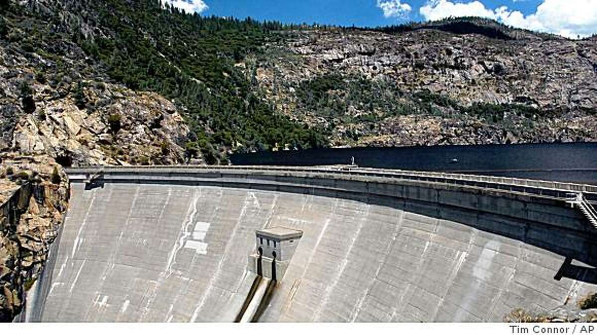 This image provided by Environmental Defense shows the O'Shaughnessy Dam on the Hetch Hetchy reservoir in Yosemite National Park, Calif., in a June 2004, file photo. A state report Wednesday, July 19, 2006, estimates the cost of tearing down the O'Shaughnessy Dam and restoring the valley would cost billions of dollars.