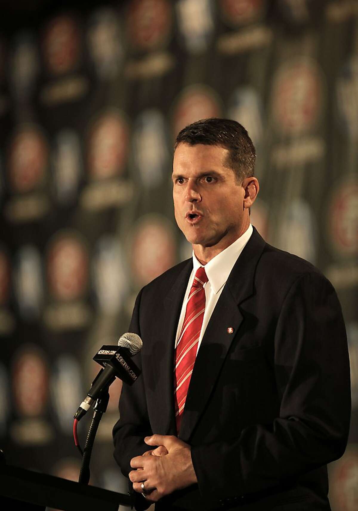 The San Francisco 49ers introduce their new head coach, Jim Harbaugh, at a news conference in San Francisco on Friday.
