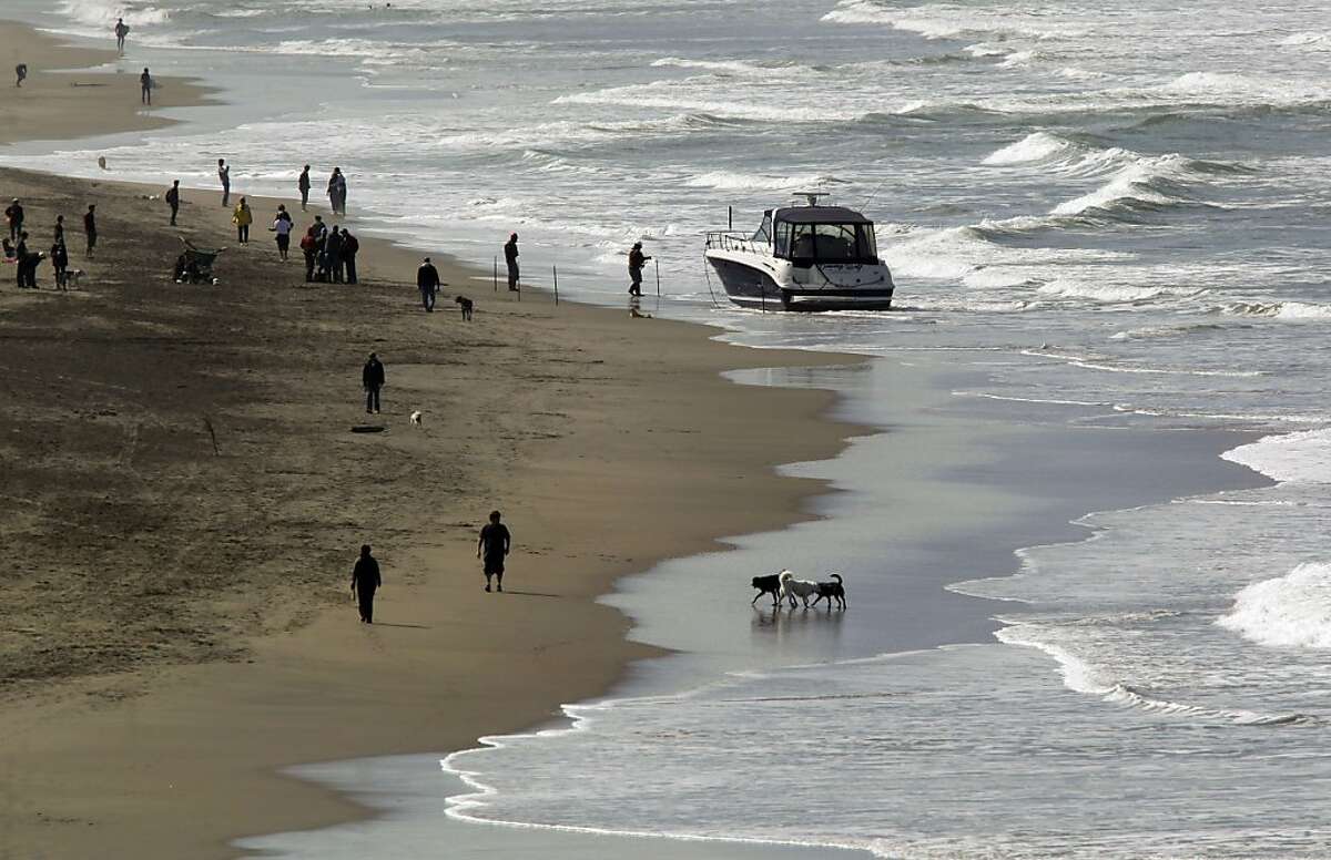 A stolen boat stuck on shore along Ocean Beach at Fulton Street. A drunken man celebrating his 35th birthday was arrested early Friday April 15, 2011, after he was found aboard a stolen boat that washed ashore on Ocean Beach in San Francisco.
