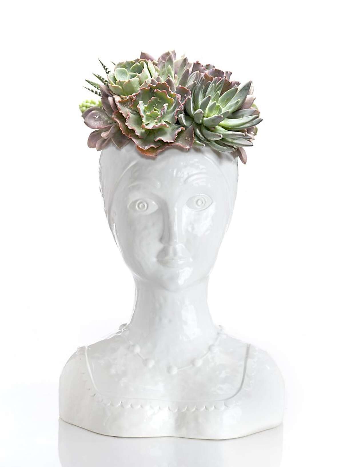 Female bust planters with succulents