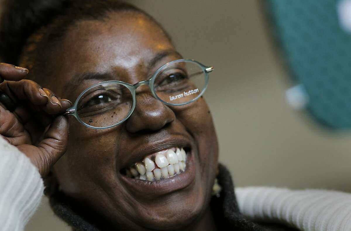 Eurisa Phillips of Point Richmond is all smiles as she picks out a new pair of glasses after her eye exam, as RAM, Remote Area Medical, holds their free clinic, offering services in dental, vision and general medicine at the Oakland Alameda County Coliseum, in Oakland, Ca. on Saturday Apr. 10, 2011.