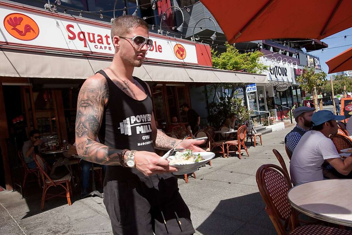 Ronnie Waite of San Francisco brings his salad to his table at the parklet in front of the Squat & Gobble Cafe and Crepery on 16th and Market Street April 4, 2011 in San Francisco, Calif. Photograph by David Paul Morris/Special to the Chronicle