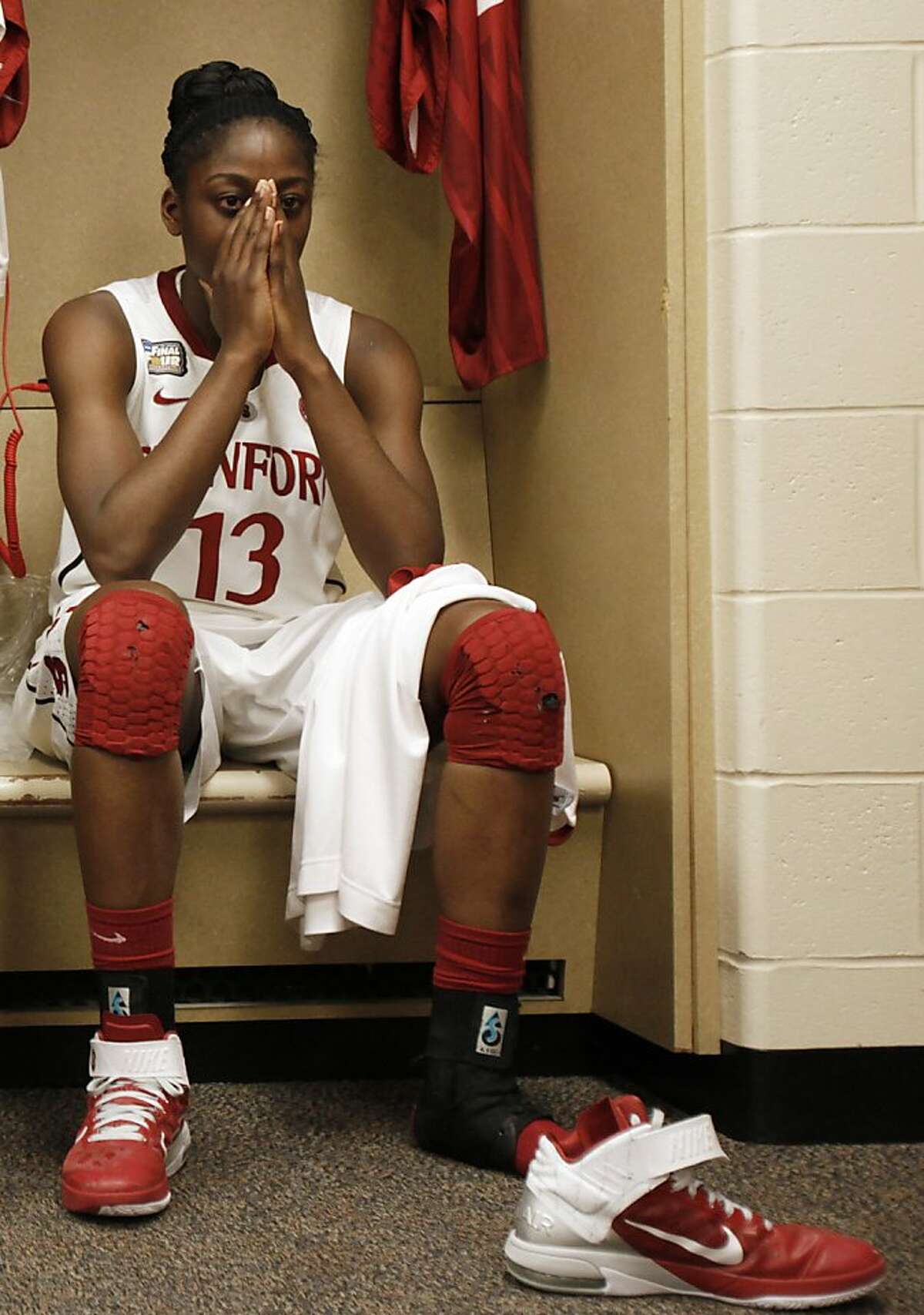 Stanford's Chiney Ogwumike (13) reacts in the locker room after Stanford's 63-62 loss to Texas A&M in a women's NCAA Final Four semifinal college basketball game in Indianapolis, Sunday, April 3, 2011.