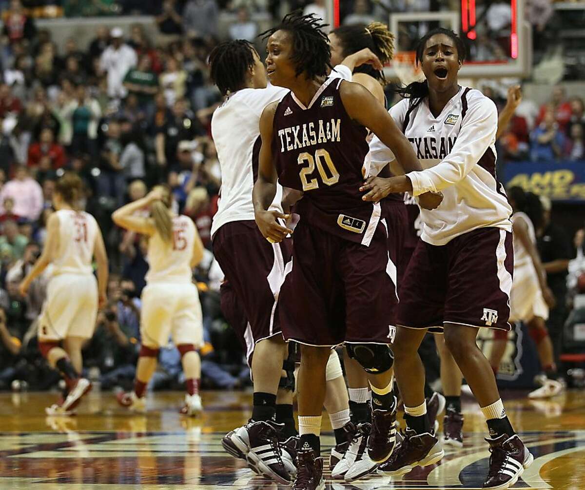 INDIANAPOLIS, IN - APRIL 03: Tyra White #20 of the Texas A&M Aggies celebrates the win with her teammates after the game against the Stanford Cardinal during the semifinals of the 2011 NCAA Women's Final Four on April 3, 2011 at Conseco Fieldhouse in Indianapolis, Indiana. The Texas A&M Aggies defeated the Stanford Cardinal 63-62. White scored the game winning basket.