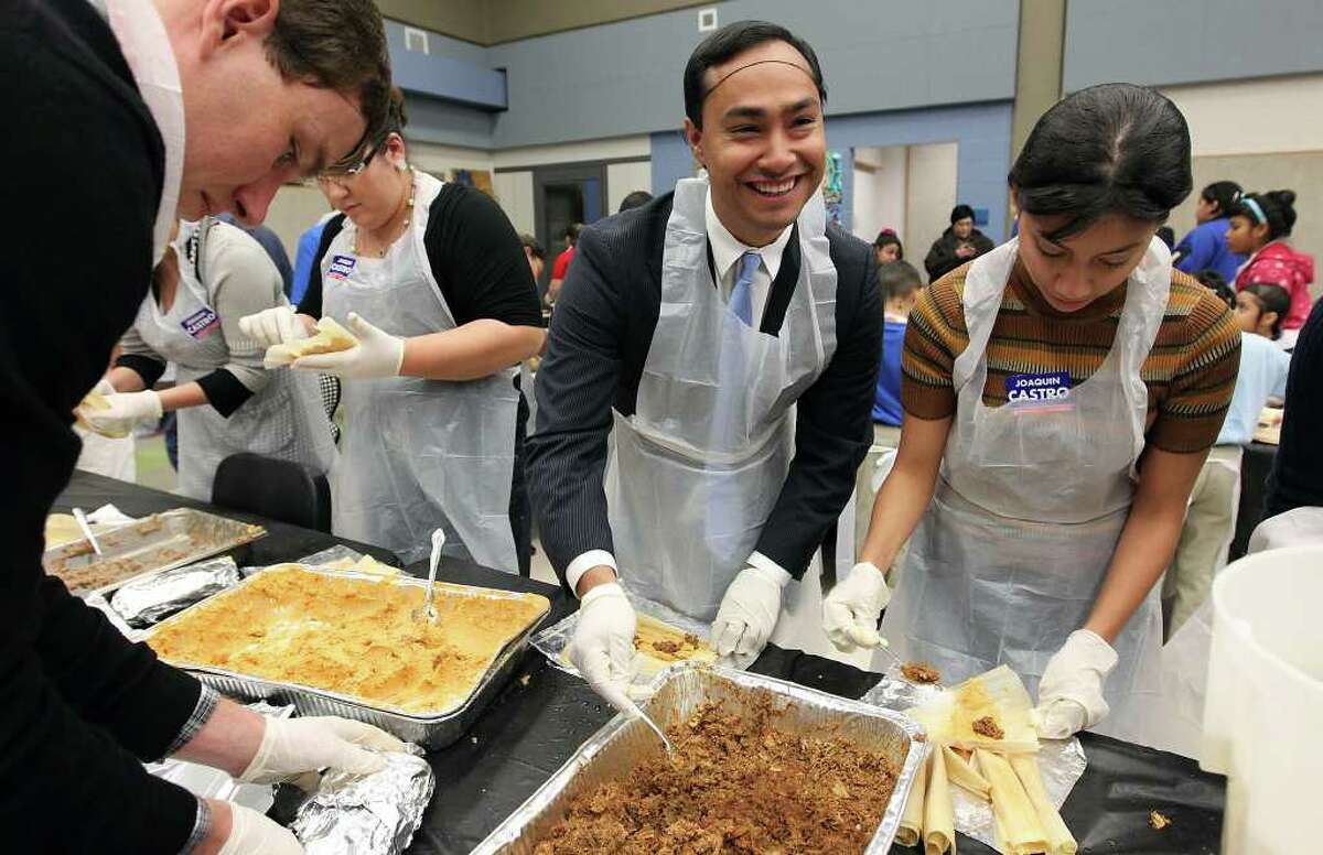 State Rep. Joaquin Castro (center) takes part in making tamales at Lanier High School for a record-setting tamalada on Wednesday, Dec. 7, 2011. Organizers said about 1,100 students and 200 neighborhood volunteers gathered at the school to make tamales and to attempt to set a record for the most made by weight. In the end, they achieved the goal of 17,232 tamales weighing in at 2,420.9 pounds. The achievement will now be sent off to Guiness Book of World Records to be certified.
