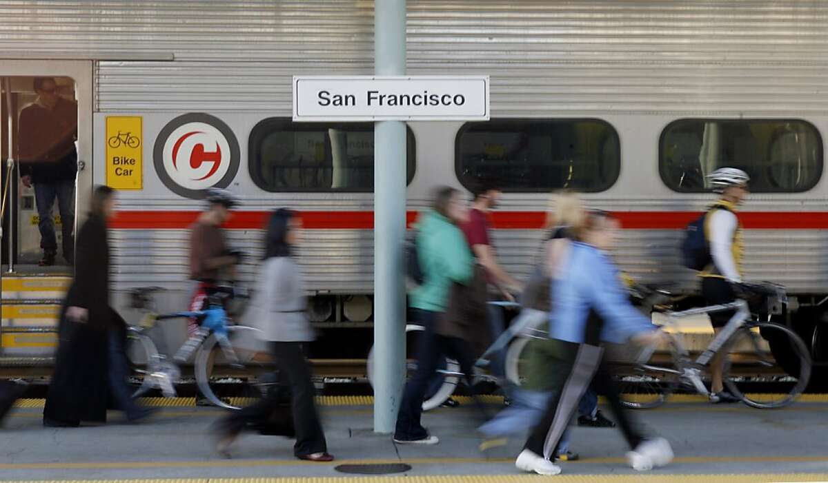 Commuters leave a train at the Caltrain station in San Francisco, Calif., on Thursday, February 19, 2009. Attempts to get more people out of their cars have fallen short, despite strong arguments from advocates who say alternatives to driving are good foCommuters leave a train at the Caltrain station in San Francisco, Calif., on Thursday, February 19, 2009. Attempts to get more people out of their cars have fallen short, despite strong arguments from advocates who say alternatives to driving are good for the environment. Ran on: 02-27-2009 Commuters disembark at the Caltrain station. The Metropolitan Transportation Commission said that in 2006, more than 10 percent of commuters used mass transit.