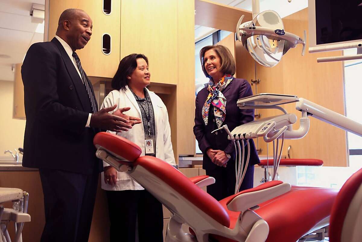 Chief executive officer Charles Range (left), and dental director Dr. Gemma Ferrer (middle) show democratic leader Nancy Pelosi (right) the dental clinic at the South of Market Health Center in San Francisco, Calif., on Monday, March 28, 2011.