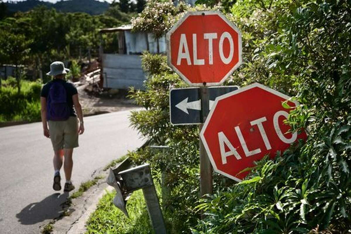 Alto (stop), obvious by the red hexagonal sign even if you don't know the word.
