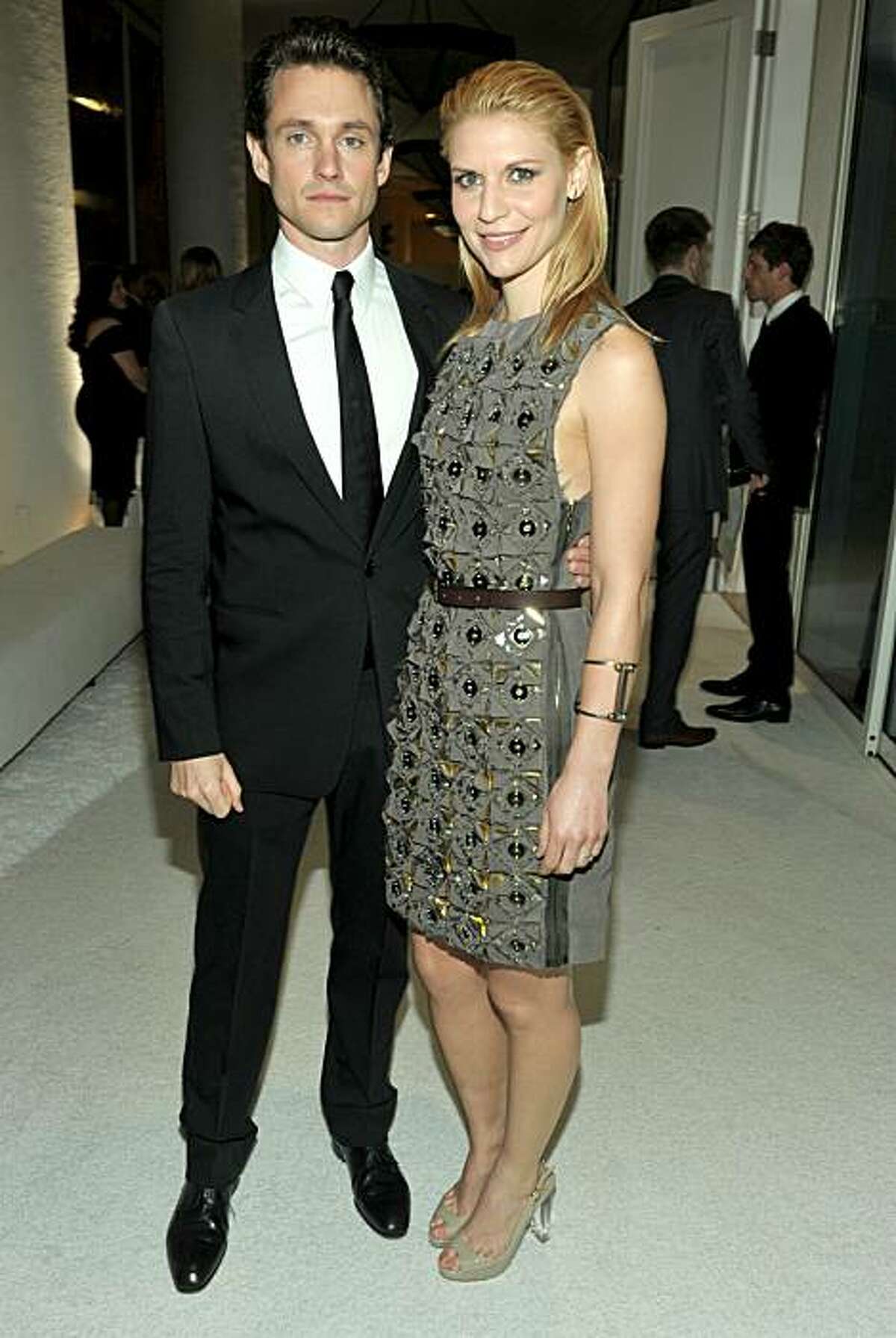 BEVERLY HILLS, CA - FEBRUARY 22: Actress Claire Danes (R) and actor Hugh Dancy arrive at the 13th Annual Costume Designers Guild Awards with presenting sponsor Lacoste held at The Beverly Hilton hotel on February 22, 2011 in Beverly Hills, California. (Photo by Alberto E. Rodriguez/Getty Images for CDG)
