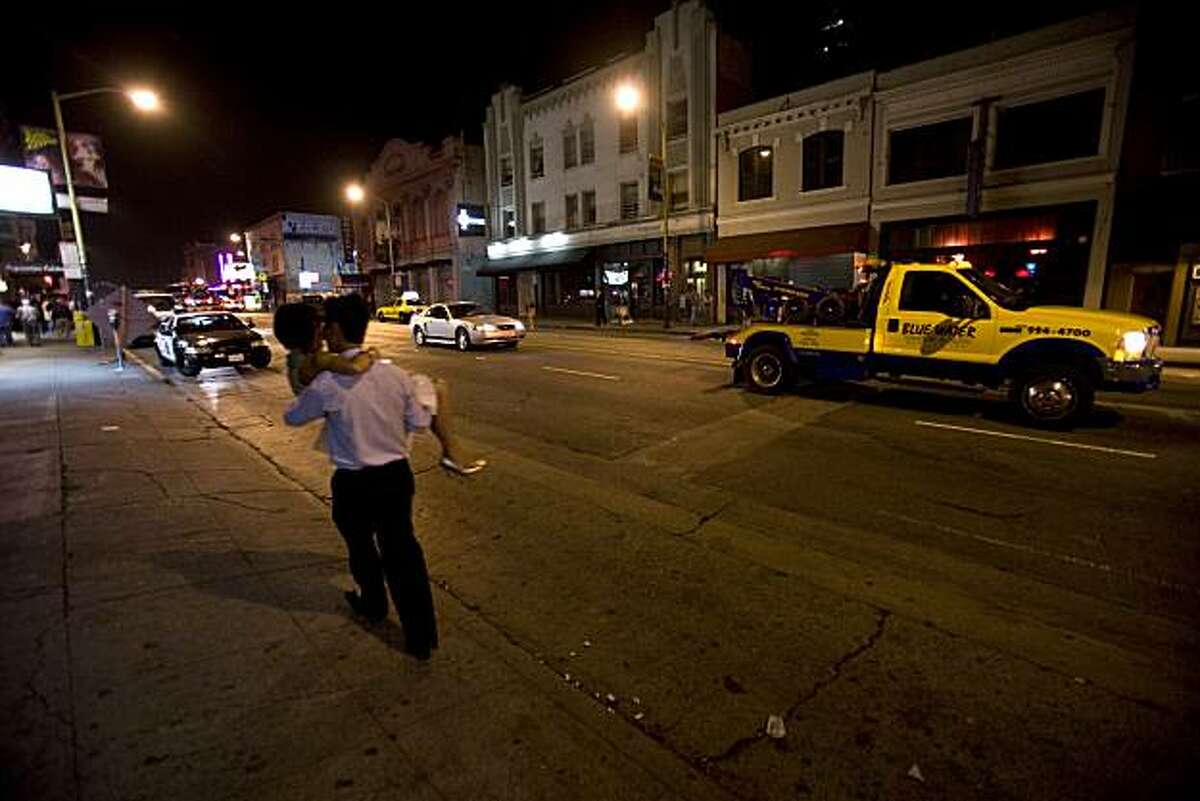 Clubbers travel on Broadway near Kearny Street in San Francisco, Calif., on Saturday, Aug. 2, 2008. Officials are cracking down on street activity outside clubs on Broadway near Columbus. "Club 443" , across the street was ordered not to open on this night.