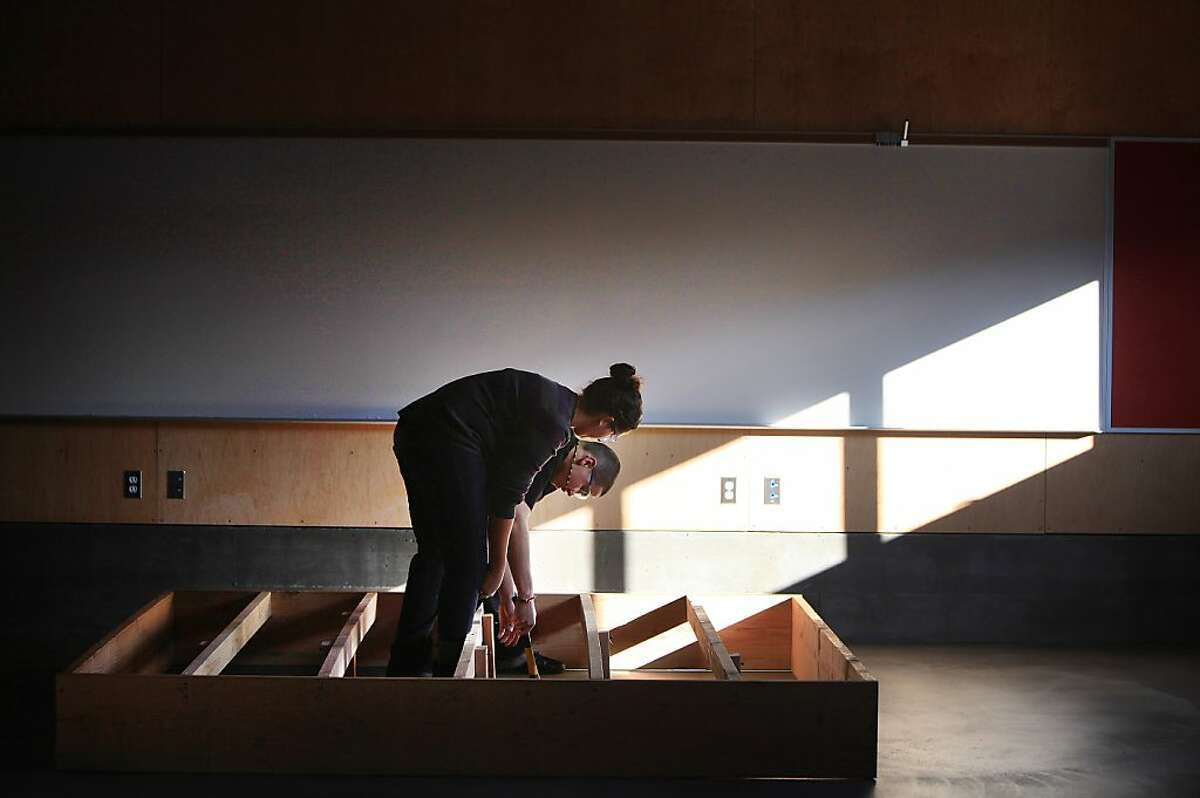John O'Connell High School advanced carpentry students Lucerito Martinez, 16, and Sergio Navarro, 17, work together to rough frame a stage being built in the new industrial arts building at John O'Connell High School on Wednesday, December 7, 2011 in San Francisco, Calif. The stage was being built for a ceremony for the new building to be held the next day. Ran on: 12-08-2011 Students Lucerito Martinez, 16, and Sergio Navarro, 17, help build a stage at OConnell High. Ran on: 12-08-2011 Students Lucerito Martinez, 16, and Sergio Navarro, 17, help build a stage at OConnell High. Ran on: 12-08-2011 Students Lucerito Martinez, 16, and Sergio Navarro, 17, help build a stage at OConnell High.