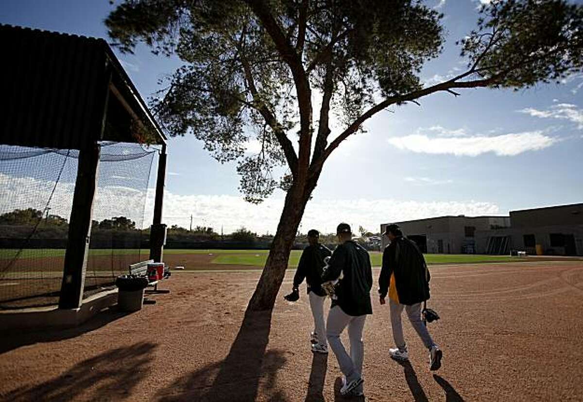 A group of A's pitchers walked to their early morning stretching. The Oakland Athletics held their second workout of the spring mostly for pitchers and catchers Thursday February 17, 2011 at Phoenix Stadium.