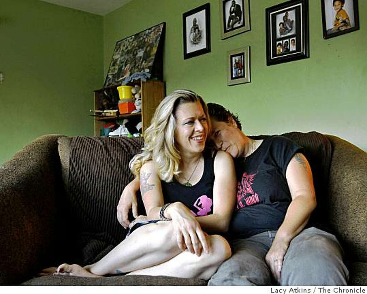 Shar Rednour (left) and Jackie Strano sit on their couch at home, Wednesday June 24, 2009, in Oakland, Calif. After meeting in 1993 they got married 1996 and now have three children.