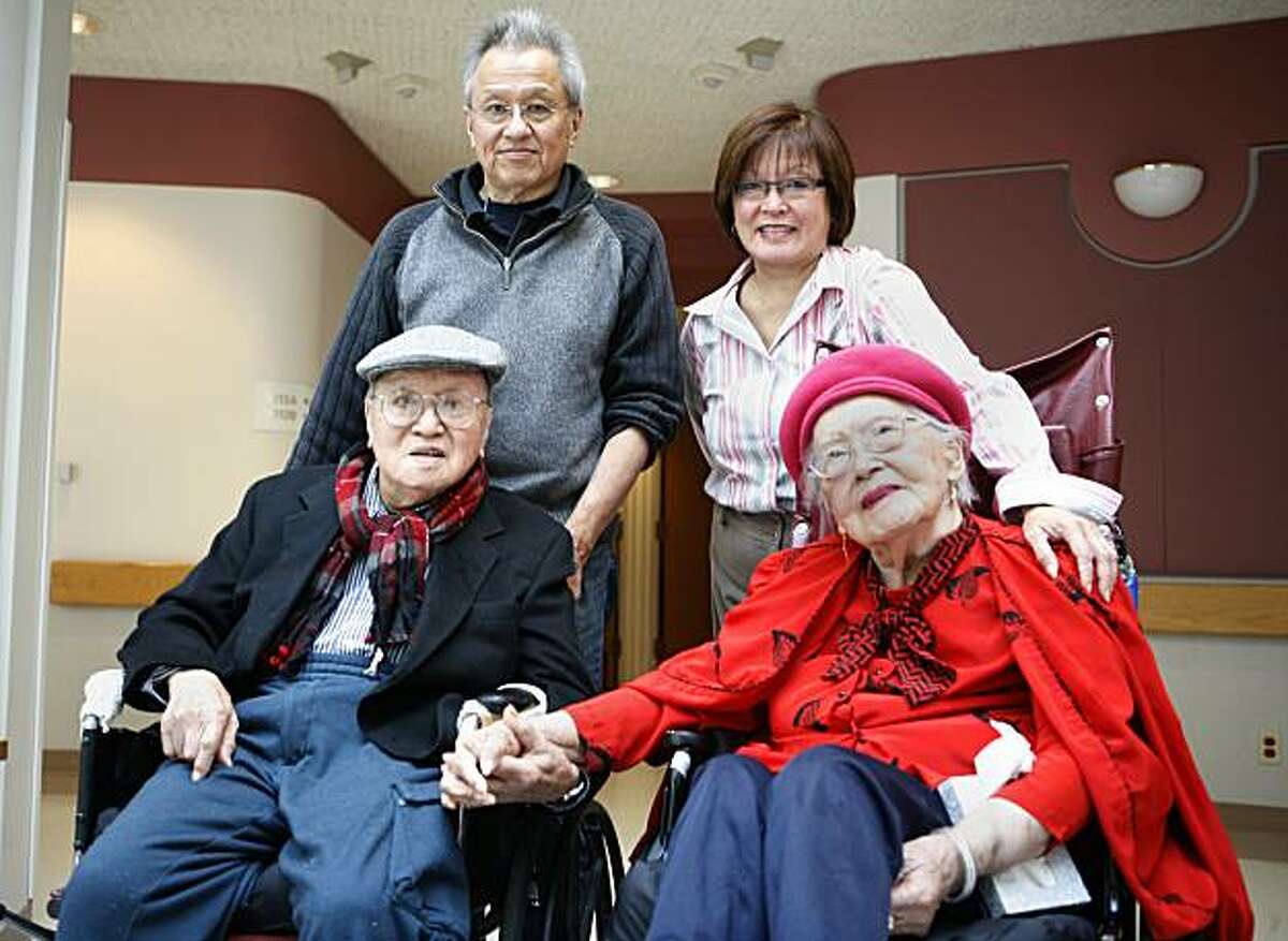 100 year-old William Chan (bottom left) and his 98-year old wife Cora Chan (bottom right) pose with their children Curtiss (top left) and Lori Chan (top right) at the Jewish Home on Friday August 6, 2010 in San Francisco Calif.