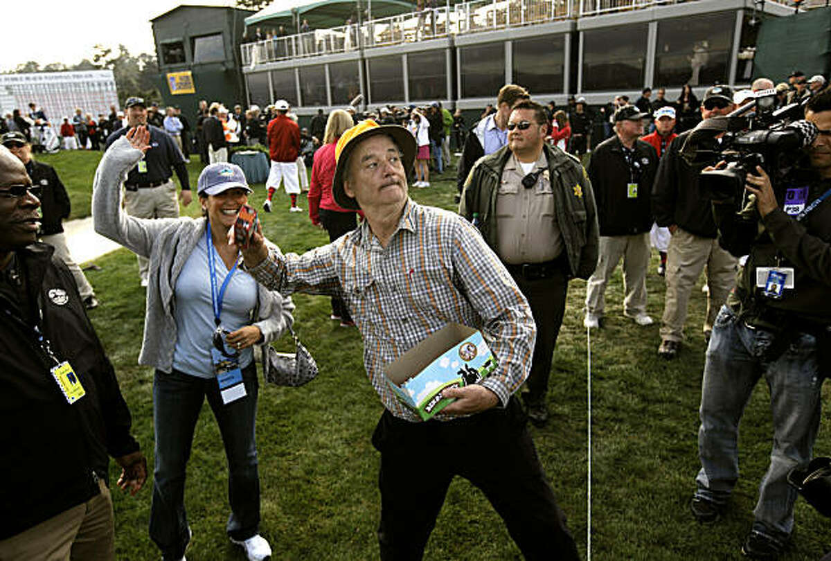 Bill Murray celebrates his amateur win by throwing ice cream into the stands at the AT&T Pebble Beach National Pro-Am on Sunday.