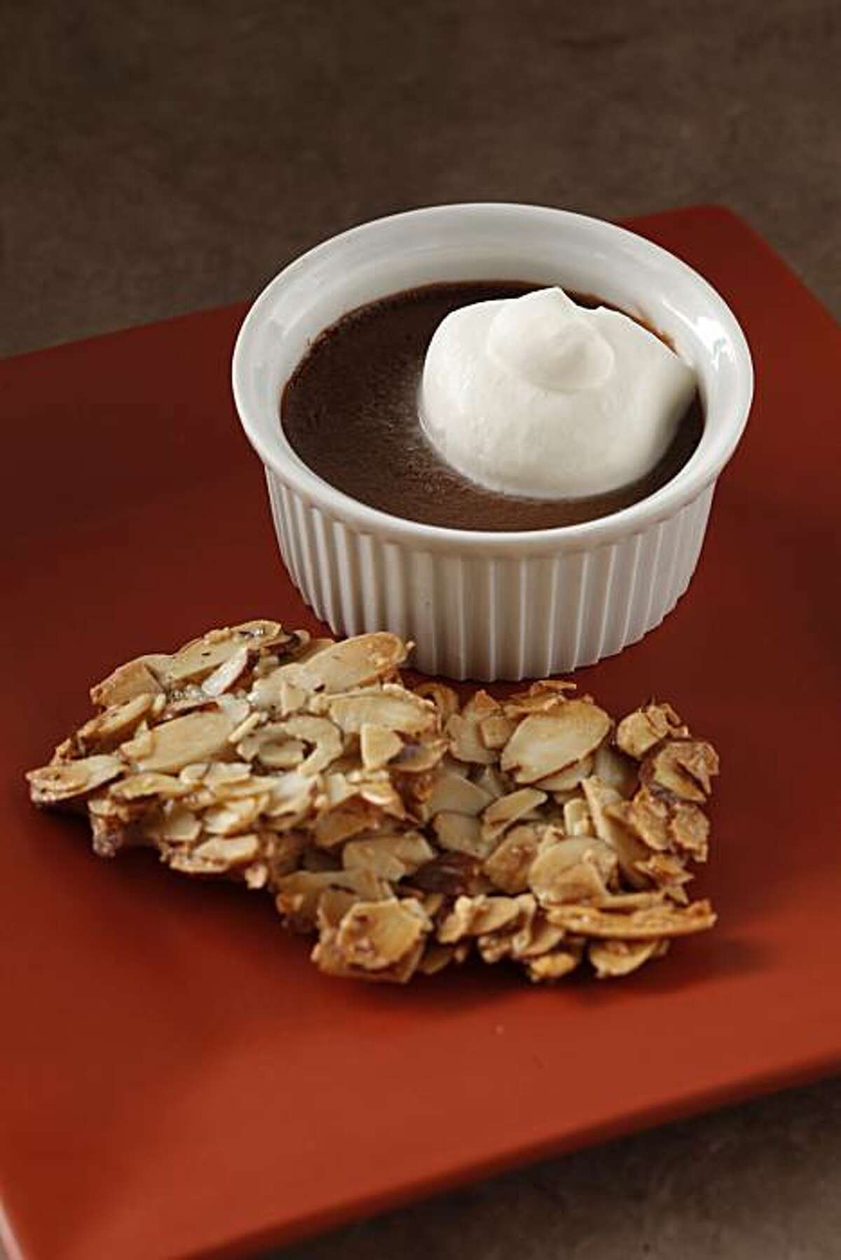 Chocolate pots de creme (Foreign Cinema) with Naomi's Almond Wafers as seen in San Francisco, California, on January 19, 2011. Food styled by Kelly Rae Hickman.