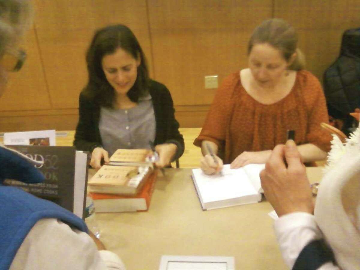 Amanda Hesser and Merrill Stubbs, authors of ìThe Food52 Cookbook,î sign books at the Darien Library. Photo by Thomas Michael