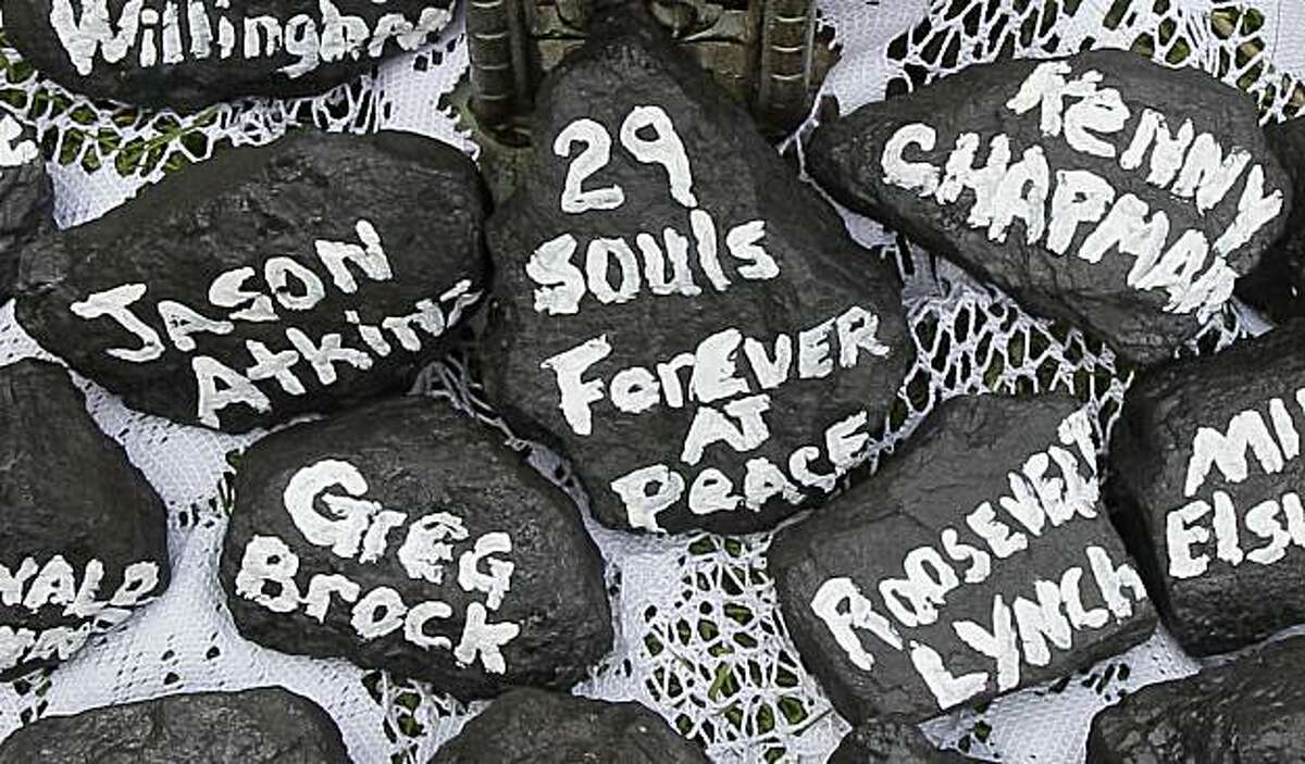 Chunks of coal bearing the names of the miners who died in the explosion at Massey Energy Co.'s Upper Big Branch mine in Montcoal, W. Va. a week ago Monday, appear in a makeshift memorial in Whitesville, W.Va. on Tuesday, April 13, 2010. Recovery teams working before dawn Tuesday finished the grim task of recovering the last of 29 West Virginia miners killed in the nation's worst coal mining disaster in decades.
