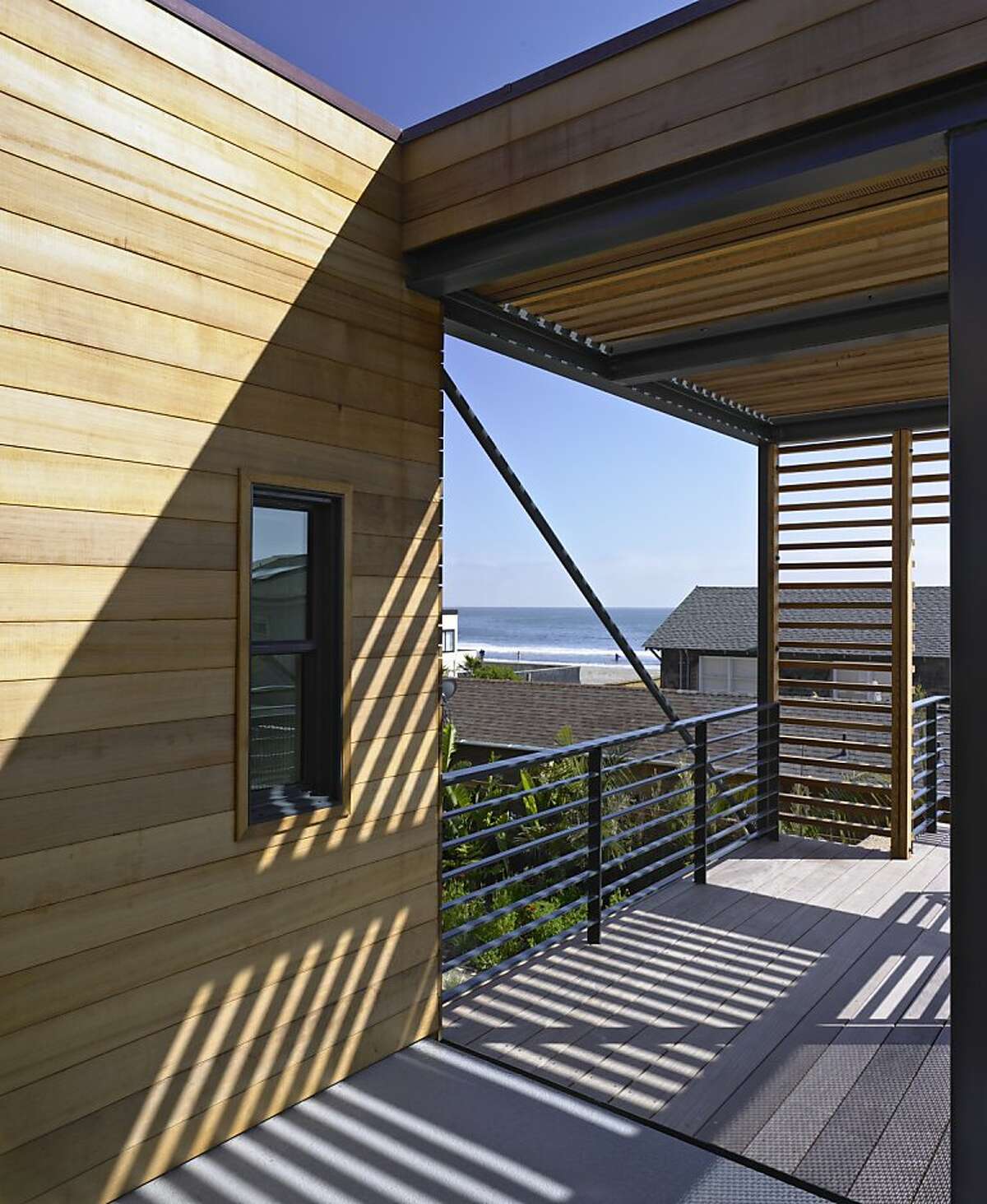 The addition, built 12 feet up, has views of the beach.