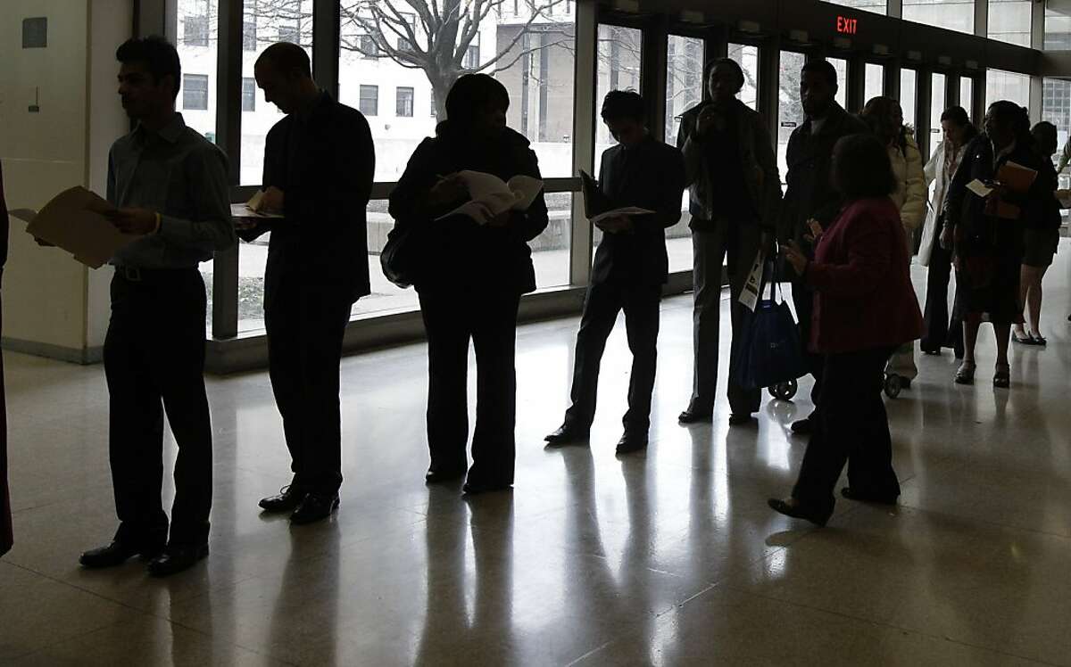 People stand in line to enter the 32nd Annual Spring Career Fair at Cleveland State University on Friday, March 4, 2011. Over 120 organizations were on hand to talk to prospective candidates about employment and internships. Employers hired in February atthe fastest pace in almost a year, and the unemployment rate fell to 8.9 percent _ a nearly two-year low.
