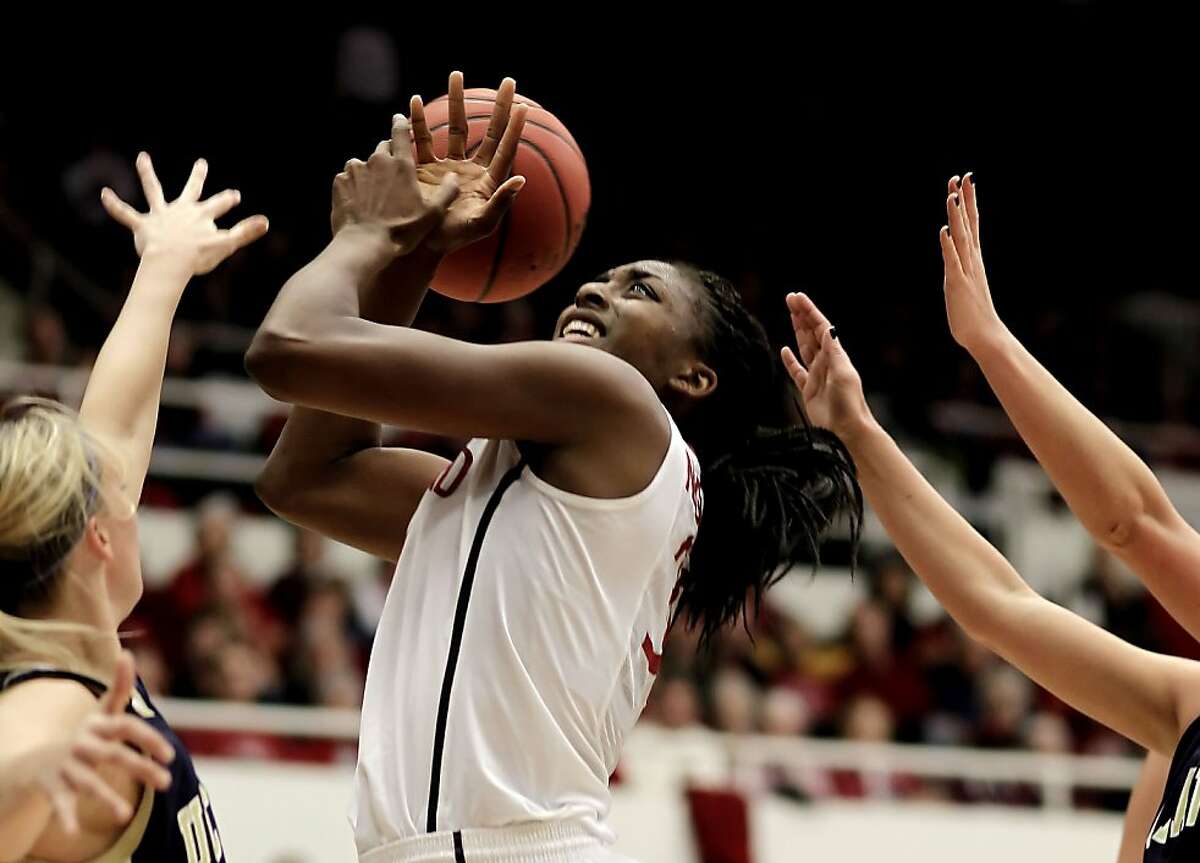 Stanford's Nnemkadi Ogwumike (30) goes up for a shot over UC Davis' Kasey Riecks (25) in the first round of the NCAA Tournament on Saturday at Maples Pavilion in Palo Alto.