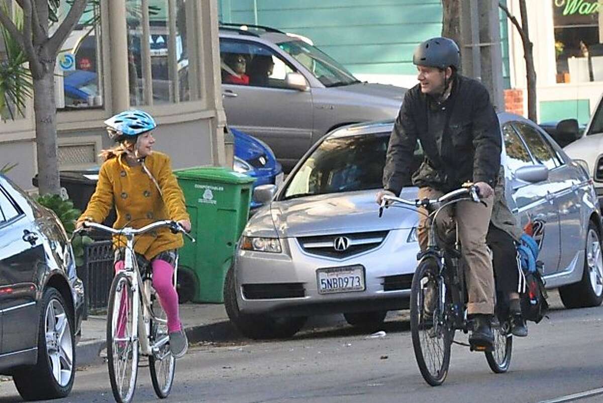 Many San Francisco kids and parents, like Hannah and Jonn Herschend, enjoy biking to school together.