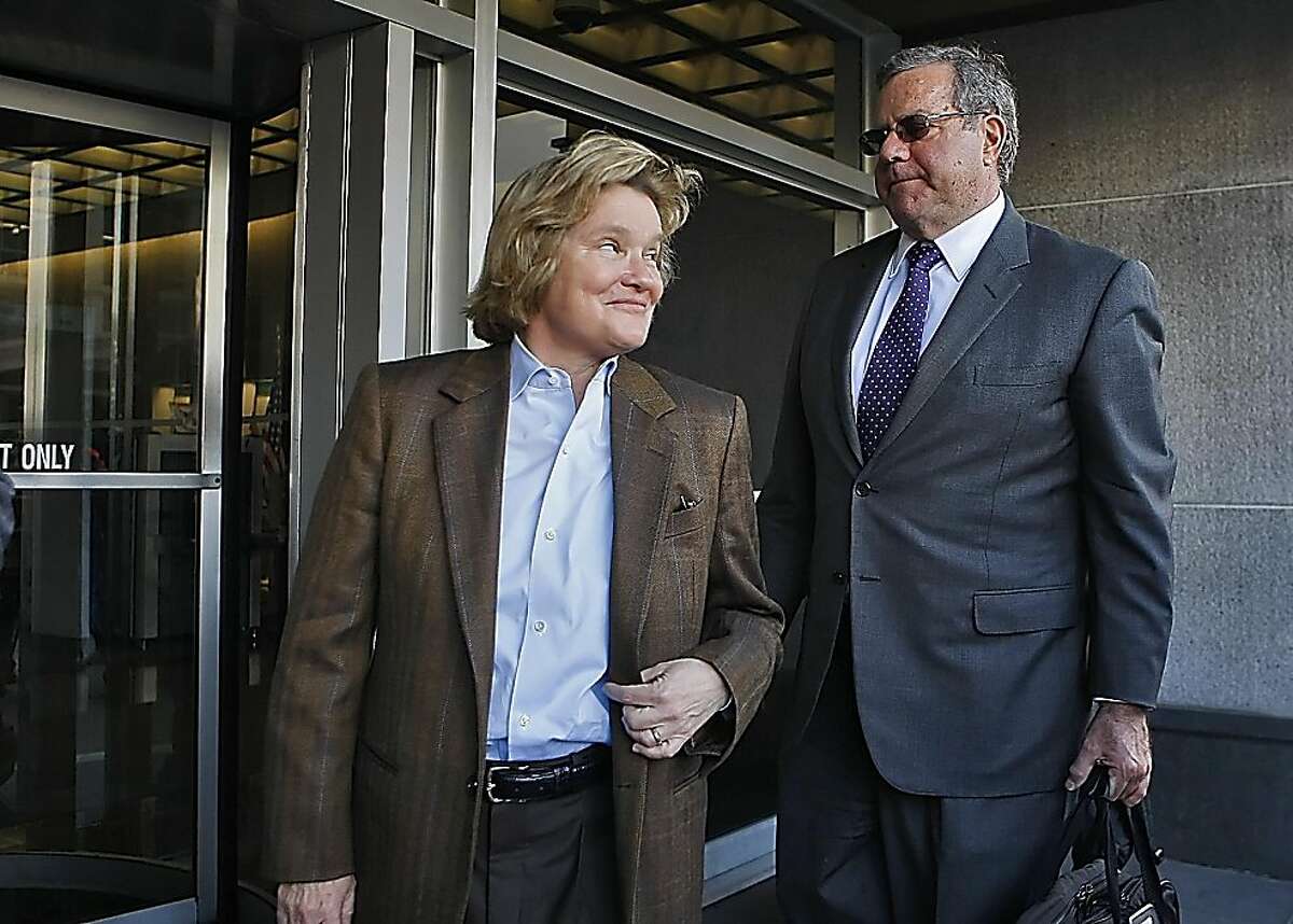 Barry Bonds's co- counsel Cris Arguedas looks back towards lead attorney Allen Rudy after answering questions outside the Federal Court Building, Monday , March 21, 2011, in San Francisco, Calif.