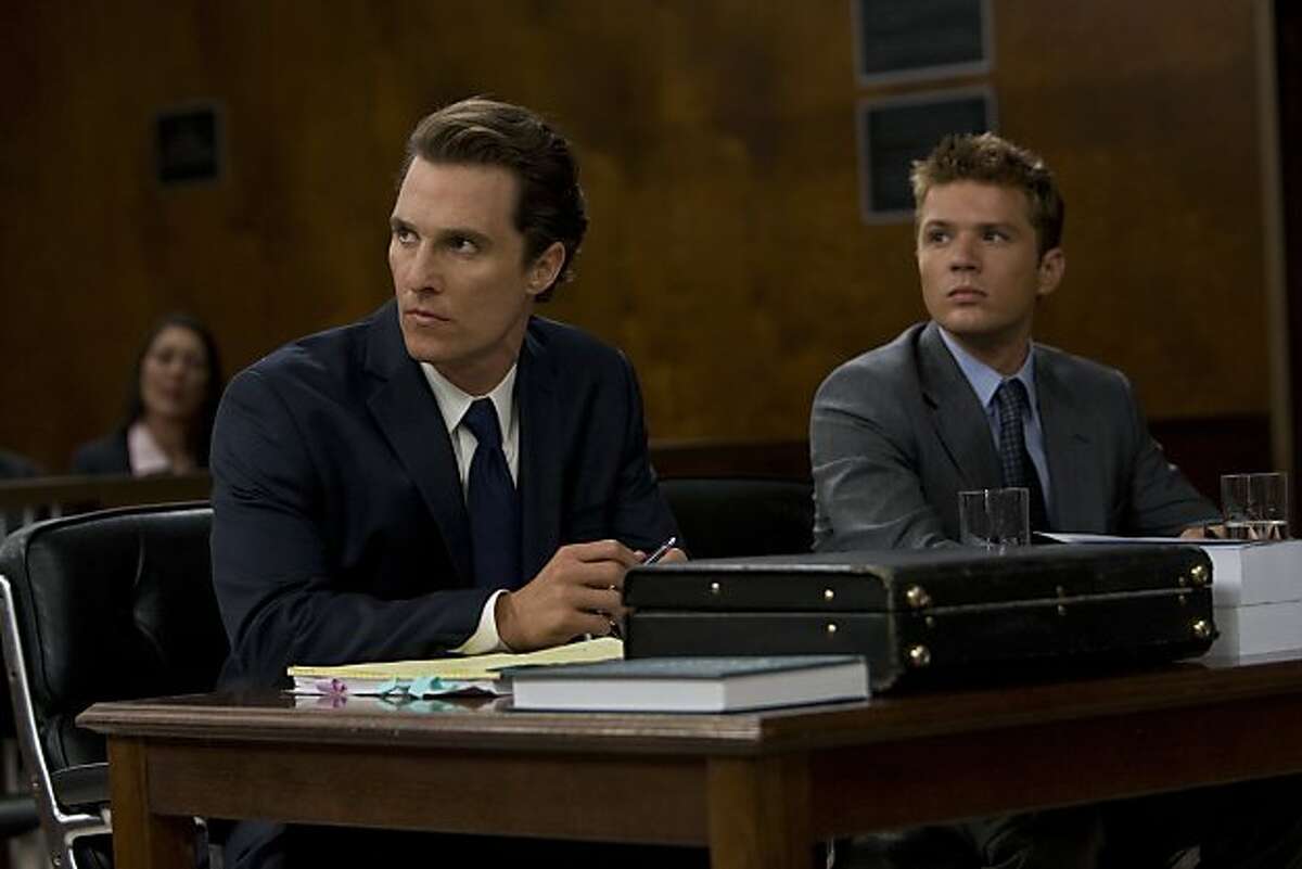 In this film publicity image released by Lionsgate, Matthew McConaughey, left, and Ryan Phillippe are shown in a scene from "The Lincoln Lawyer."