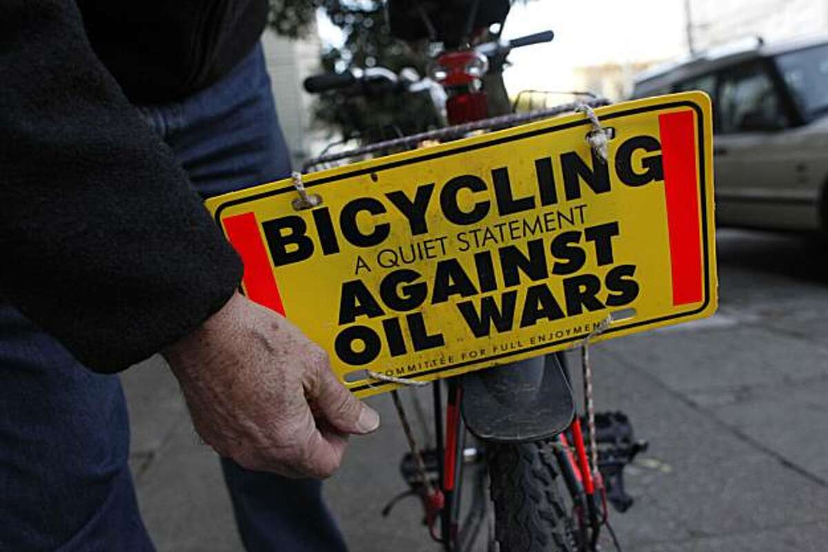 David Hartsough, 70, longtime peace activist who founded Nonviolent Peaceforce, adjusts a sign on the back of his bike on Friday January 14, 2011 in San Francisco, Calif.