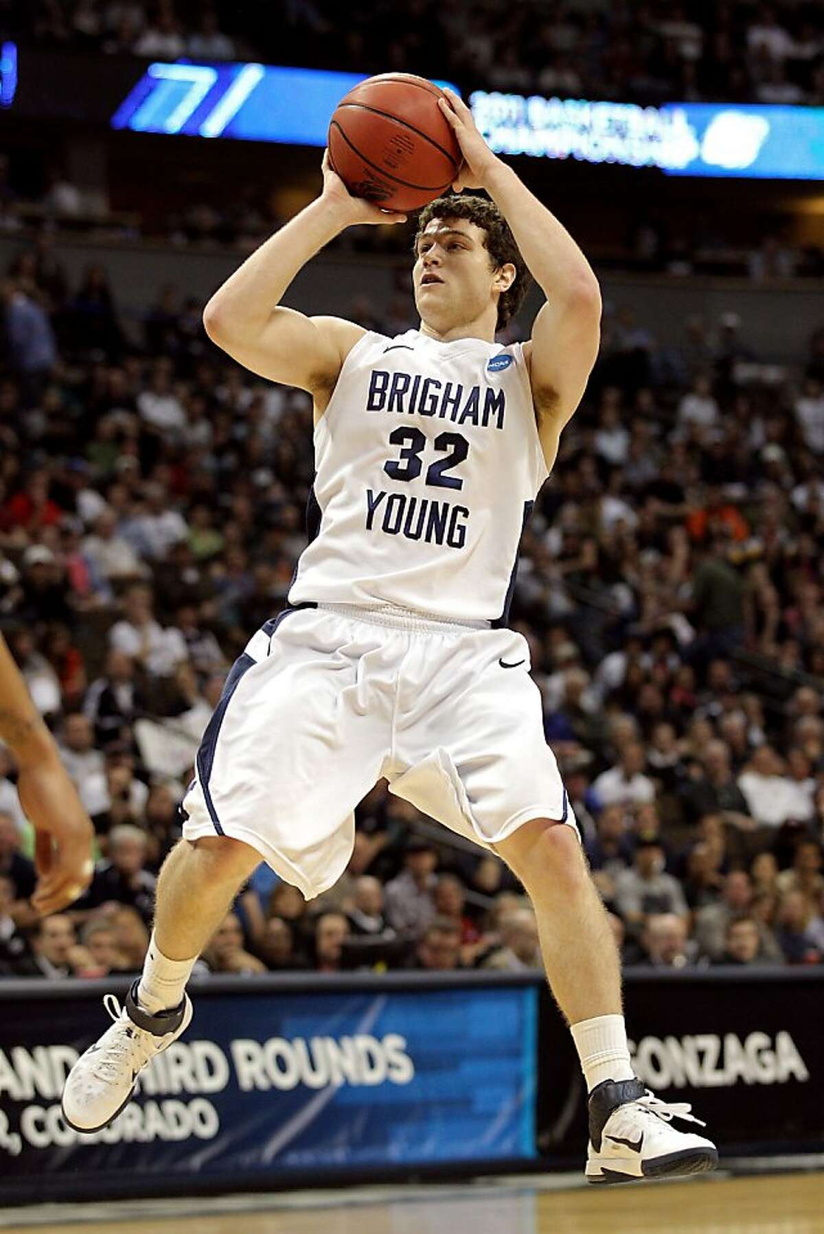 Jimmer Fredette #32 of the Brigham Young Cougars shoot against the Gonzaga Bulldogs during the third round of the 2011 NCAA men's basketball tournament at Pepsi Center on March 19, 2011 in Denver, Colorado.