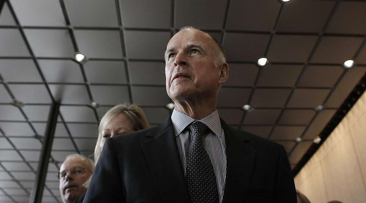 Gov. Jerry Brown arrives at a news conference at Bank of America Tower in San Francisco, Friday, March 4, 2011.