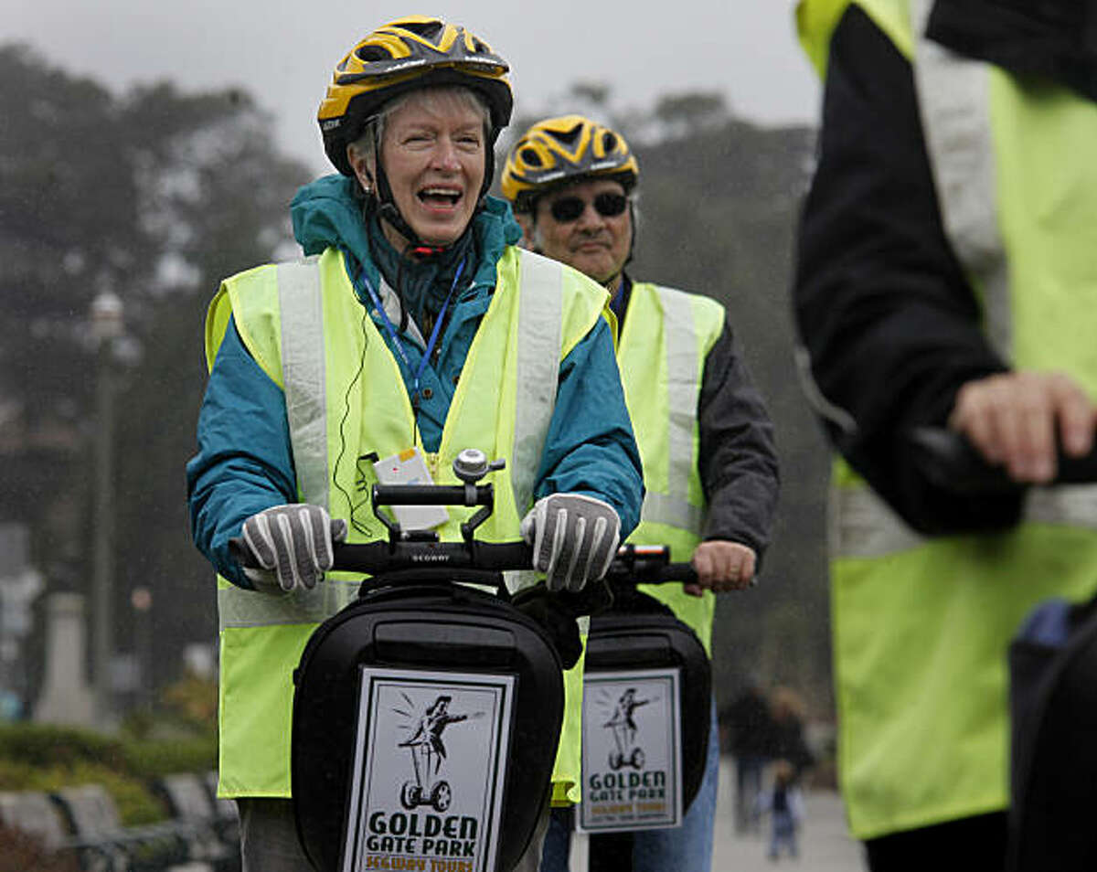 Pat Marion of Palo Alto laughs as she travels past the California Academy of Science Sunday March 13, 2011. Segway tours in Golden Gate Park in San Francisco, Calif. are a new popular way to see the sights, but a small group of people don't like the latest commercialization of their park.