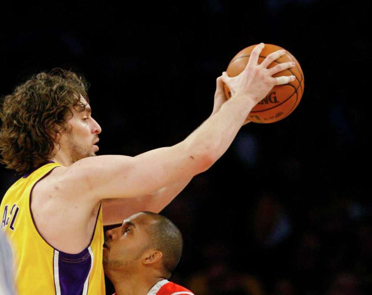 Nick de la Torre: Chronicle HOLD EVERYTHING: Lakers center Pau Gasol, top, would have come to the Rockets in a deal that was supposed to include Luis Scola and Kevin Martin.