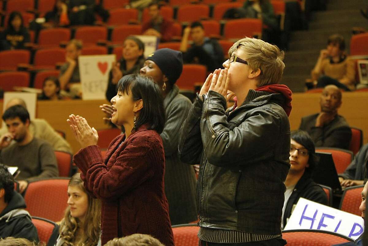 Yvette Felarca (left) interrupts UC Berkeley Chancellor Robert Birgeneau as he addresses the Cal Student Senate, as well as other students and attendees, in the Berdahl Room of Stanley Hall in Berkeley, Calif., on Wednesday, Dec. 6, 2011.