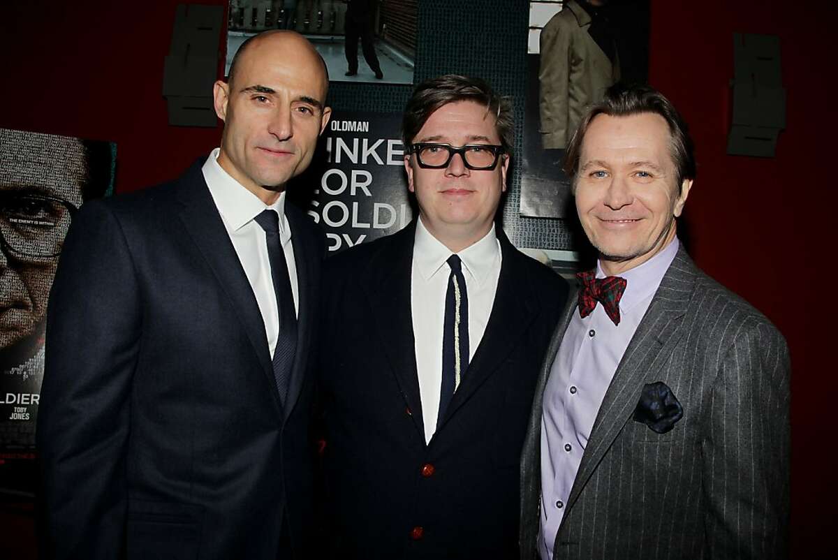 Mark Strong, from left, Tomas Alfredson and Gary Oldman pose at a special screening of Focus Features' "Tinker Tailor Soldier Spy," at the Landmark Theatres Sunshine Cinema, Wednesday, Nov. 30, 2011 in New York. (AP Photo/Starpix, Dave Allocca)