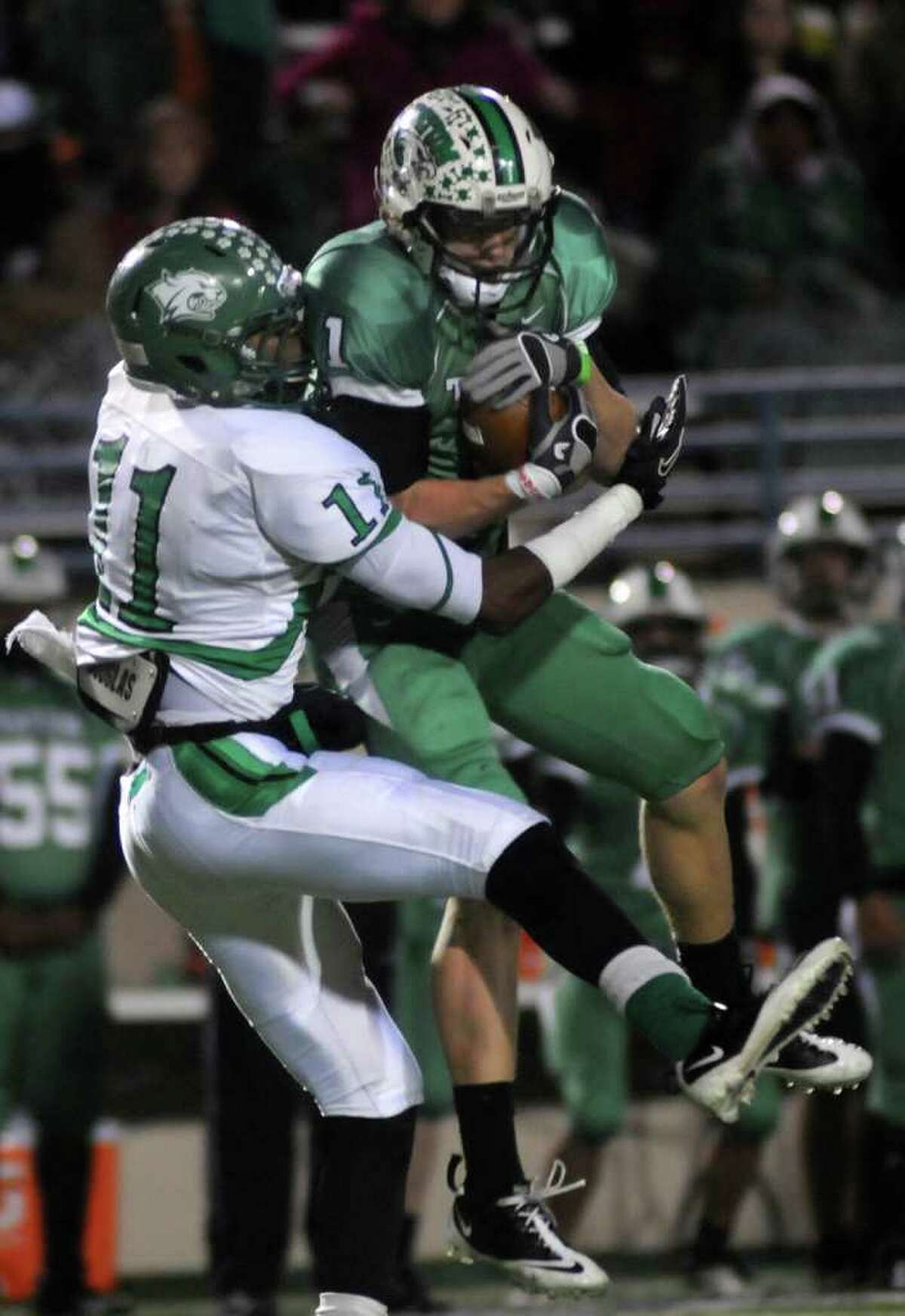 JERRY BAKER: FOR THE CHRONICLE CLOSE ONE: Hempstead receiver Trent Momon, left, tries to break up an interception by Tatum defensive back Nate Pickett during the Bobcats' Class 2A Division I semifinal win.