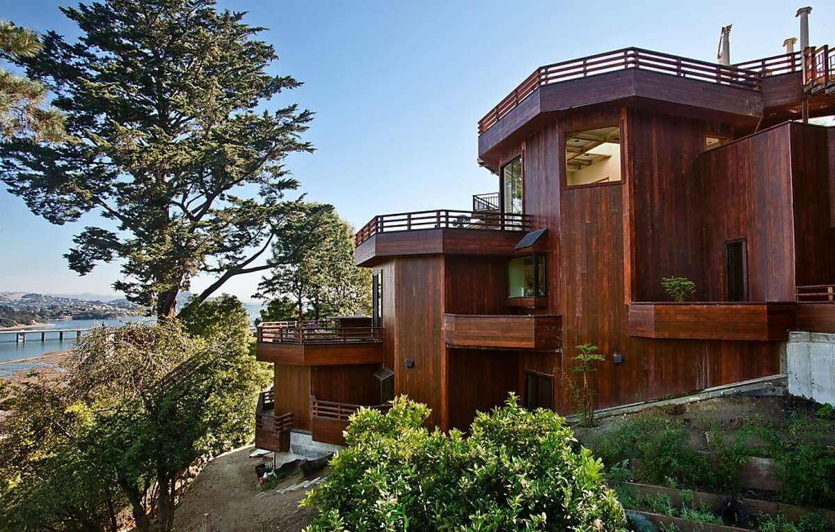 Providing three rooftop terraces and numerous vistas, the home's unique construction consists of three octagons placed on a rectangle. The exterior is an environmentally sound cement-board, which is fire resistant.