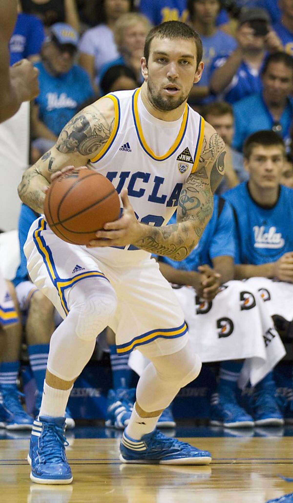 In this Nov. 21, 2011, photo, UCLA forward Reeves Nelson looks for an open teammate during an NCAA college basketball game against Chaminade in Lahaina, Hawaii. Nelson has been suspended indefinitely for a second time from the UCLA basketball team, a situation that coach Ben Howland described Tuesday, Dec. 6, 2011, as "very difficult." (AP Photo/Eugene Tanner) Ran on: 12-10-2011 Photo caption Dummy text goes here. Dummy text goes here. Dummy text goes here. Dummy text goes here. Dummy text goes here. Dummy text goes here. Dummy text goes here. Dummy text goes here.###Photo: names10_PHnelson1321747200FR168001 AP###Live Caption:In this Nov. 21, 2011, photo, UCLA forward Reeves Nelson looks for an open teammate during an NCAA college basketball game against Chaminade in Lahaina, Hawaii. Nelson has been suspended indefinitely for a second time from the UCLA basketball team, a situation that coach Ben Howland described Tuesday, Dec. 6, 2011, as "very difficult."###Caption History:In this Nov. 21, 2011, photo, UCLA forward Reeves Nelson looks for an open teammate during an NCAA college basketball game against Chaminade in Lahaina, Hawaii. Nelson has been suspended indefinitely for a second time from the UCLA basketball team, a situation that coach Ben Howland described Tuesday, Dec. 6, 2011, as "very difficult." (AP Photo-Eugene Tanner)###Notes:Reeves Nelson###Special Instructions:NOV. 21, 2011, PHOTO