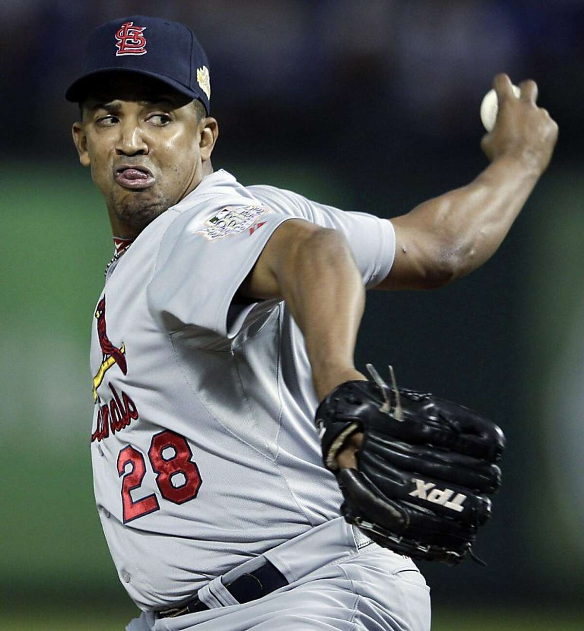 FILE - In this Oct. 24, 2011, file photo, St. Louis Cardinals relief pitcher Octavio Dotel throws during the eighth inning of Game 5 of baseball's World Series against the Texas Rangers in Arlington, Texas. Dotel is on the verge of an unusual record. He has reached an agreement with the Detroit Tigers on a one-year deal, with a team option for 2013. When he takes the mound for the Tigers next season, the reliever will be playing for a record 13th major league franchise. (AP Photo/Matt Slocum, FIle) Ran on: 12-10-2011 Photo caption Dummy text goes here. Dummy text goes here. Dummy text goes here. Dummy text goes here. Dummy text goes here. Dummy text goes here. Dummy text goes here. Dummy text goes here.###Photo: names10_PHdotel1319328000AP###Live Caption:FILE - In this Oct. 24, 2011, file photo, St. Louis Cardinals relief pitcher Octavio Dotel throws during the eighth inning of Game 5 of baseball's World Series against the Texas Rangers in Arlington, Texas. Dotel is on the verge of an unusual record. He has reached an agreement with the Detroit Tigers on a one-year deal, with a team option for 2013. When he takes the mound for the Tigers next season, the reliever will be playing for a record 13th major league franchise.###Caption History:FILE - In this Oct. 24, 2011, file photo, St. Louis Cardinals relief pitcher Octavio Dotel throws during the eighth inning of Game 5 of baseball's World Series against the Texas Rangers in Arlington, Texas. Dotel is on the verge of an unusual record. He has reached an agreement with the Detroit Tigers on a one-year deal, with a team option for 2013. When he takes the mound for the Tigers next season, the reliever will be playing for a record 13th major league franchise. (AP Photo-Matt Slocum, FIle)###Notes:###Special Instructions:AN OCT. 24, 2011 FILE PHOTO