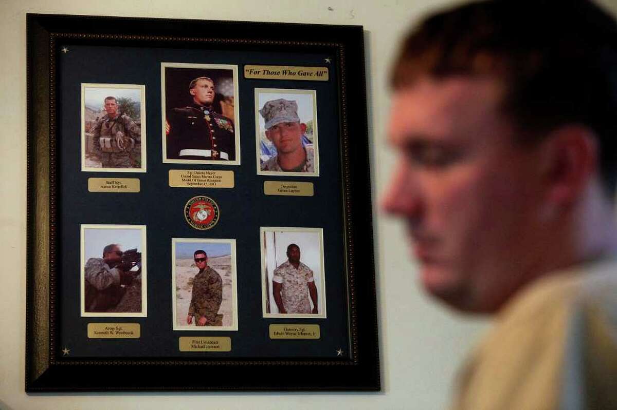 Photos of himself and the four men in his unit who were killed in the battle, along with that of another trooper who was injured and died a month later, hang in Dakota Meyer’s office at Lindsey Wilson College in Columbia, Ky.