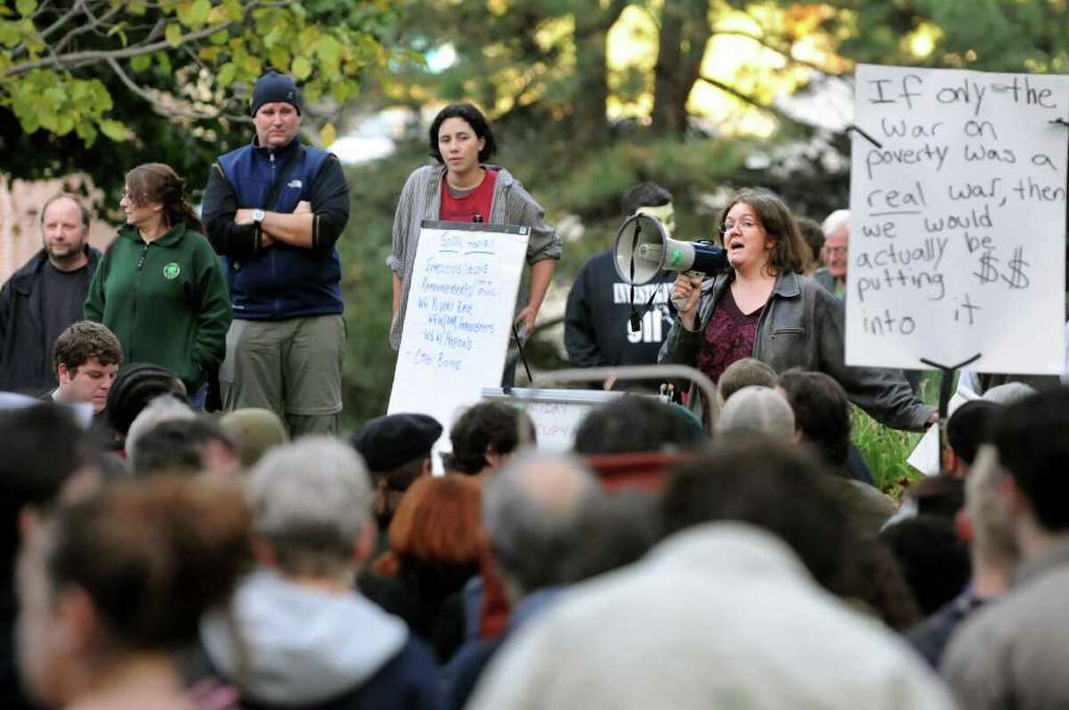 Rebecca Tell of Albany, a facilitator for the general assembly, right, speaks during Occupy Albany on Friday, Oct. 21, 2011, at Academy Park in Albany, N.Y. (Cindy Schultz / Times Union)