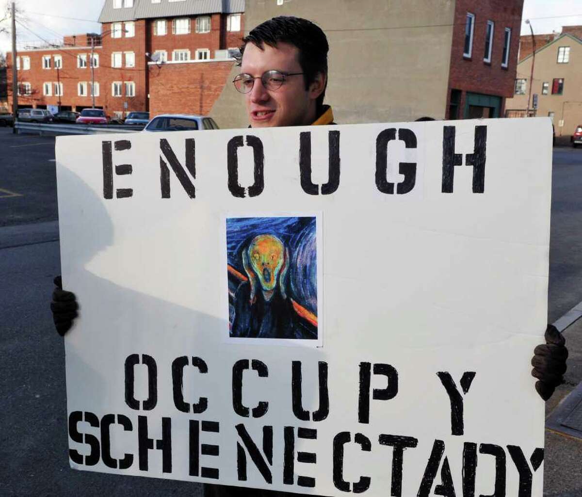 Schenectady High School student Anthony Hadden, 19, carries a sign during Occupy Schenectady's "March on General Electric " in Schenectady Saturday Dc. 10, 2011. (John Carl D'Annibale / Times Union)