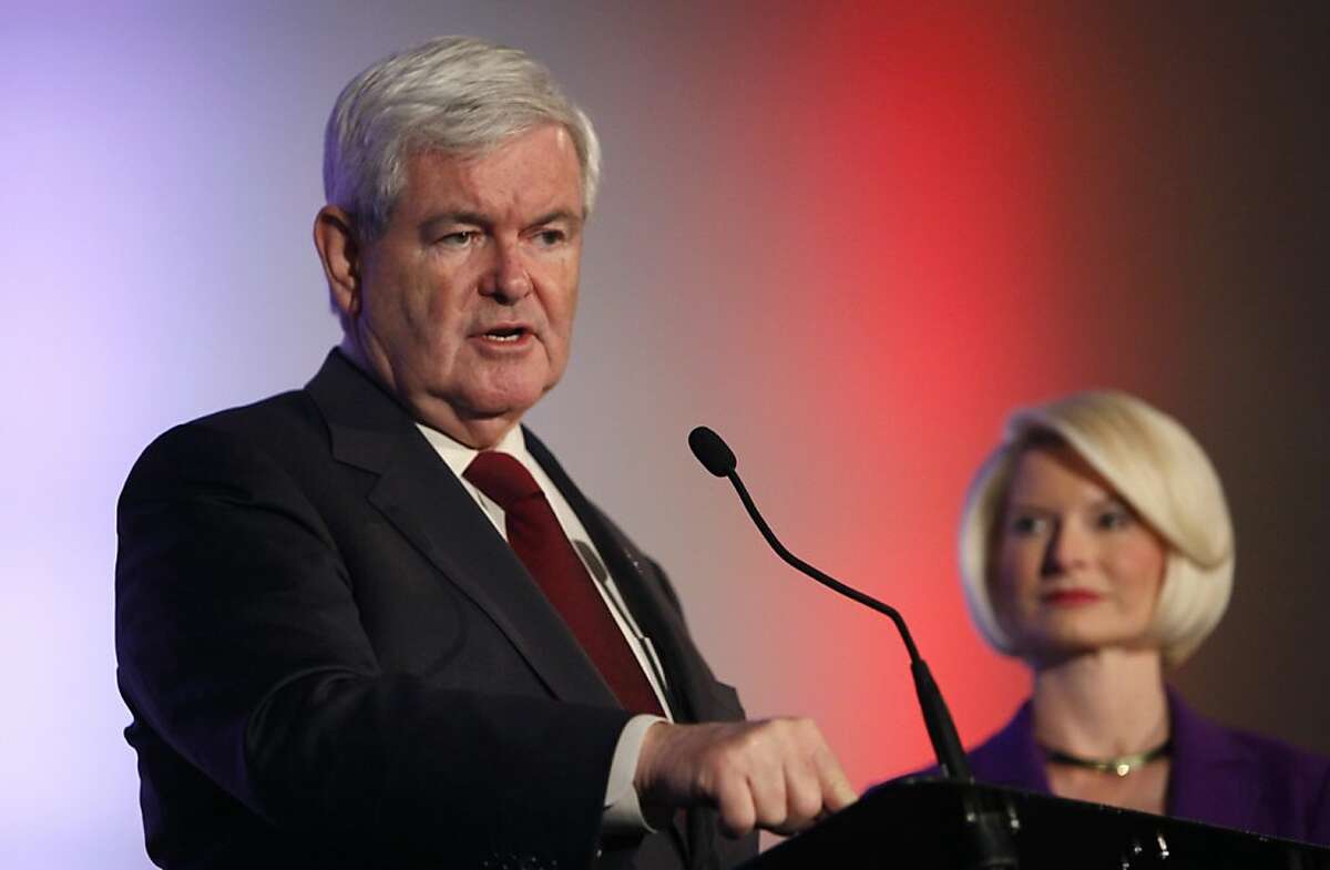 Republican presidential candidate and former House Speaker Newt Gingrich speaks during the Iowa Veterans Presidential Candidate Forum as his wife Callista looks on, Saturday, Dec. 10, 2011, in Des Moines, Iowa. (AP Photo/Charlie Neibergall) Ran on: 12-11-2011 GOP presidential candidate Newt Gingrich speaks at a forum in Iowa as his wife, Callista, listens.
