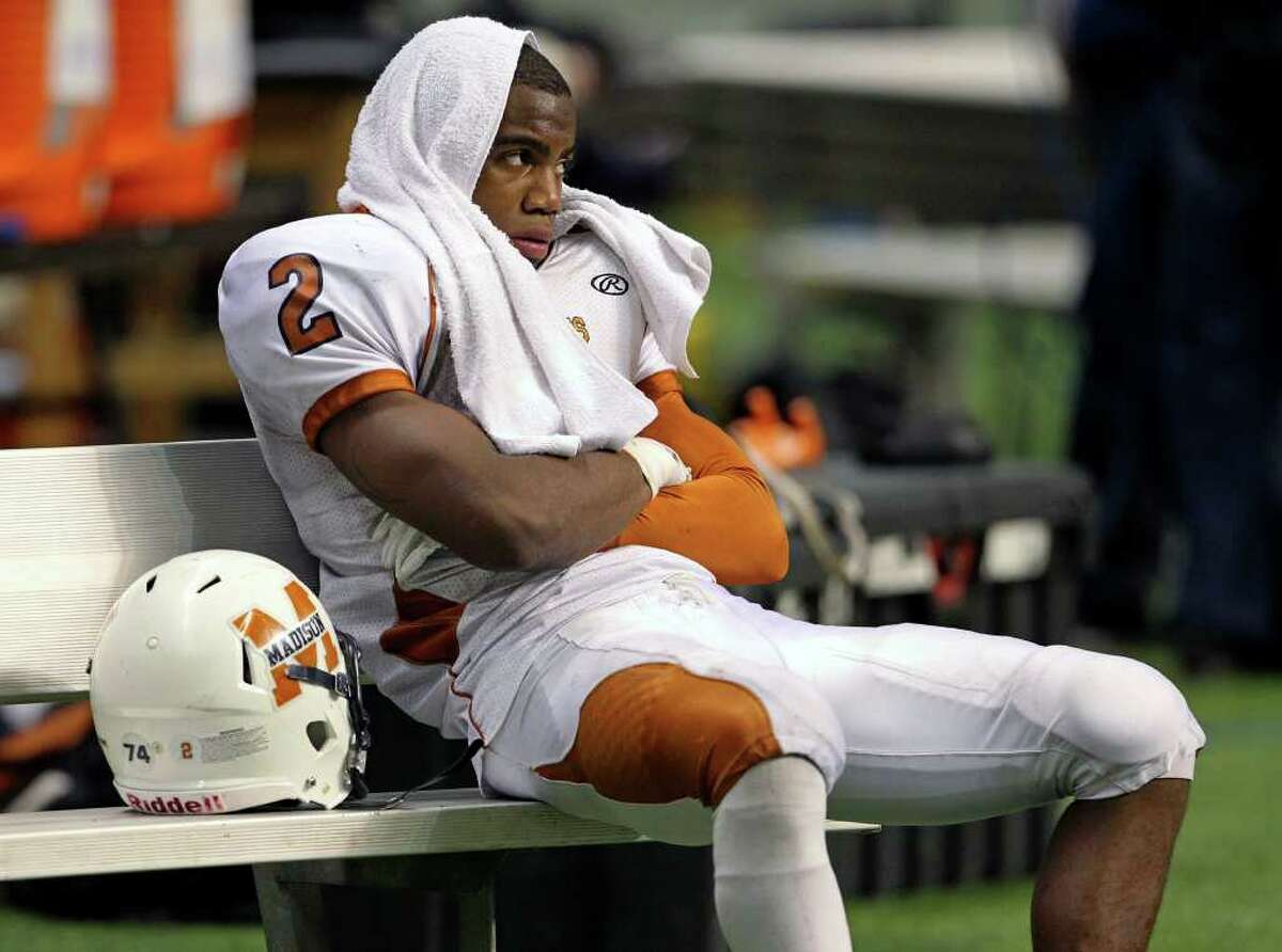 SPORTS Marquise Warford waits out the final minutes as Madison loses to Fort Bend Hightower at the Alamodome in the state semifinal playoffs on December 10, 2011 Tom Reel/Staff
