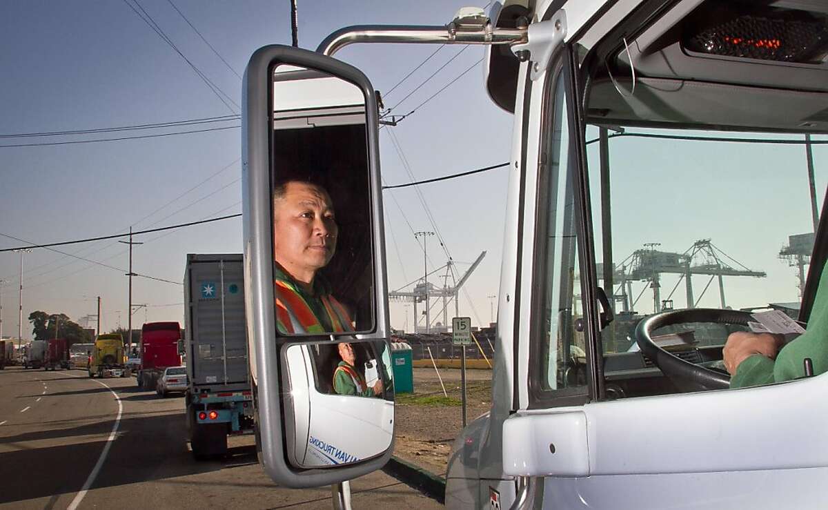 Truck driver Hai Ngo of San Leandro in his truck at the Port of Oakland in Oakland, Calif., on Friday, December 9, 2011. Story about how Occupy Oakland plans to shut down the Port of Oakland on December 12th.