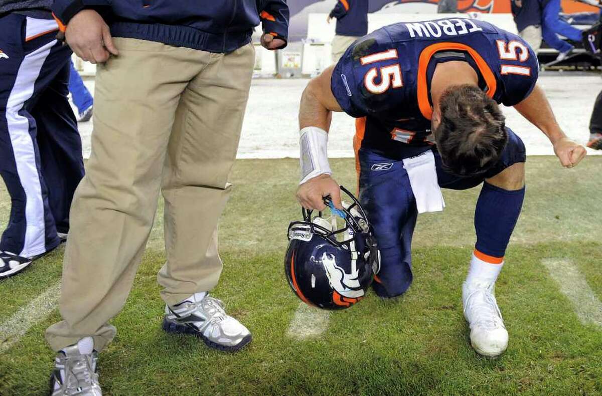 Denver Broncos quarterback Tim Tebow (15) throws a pass in the