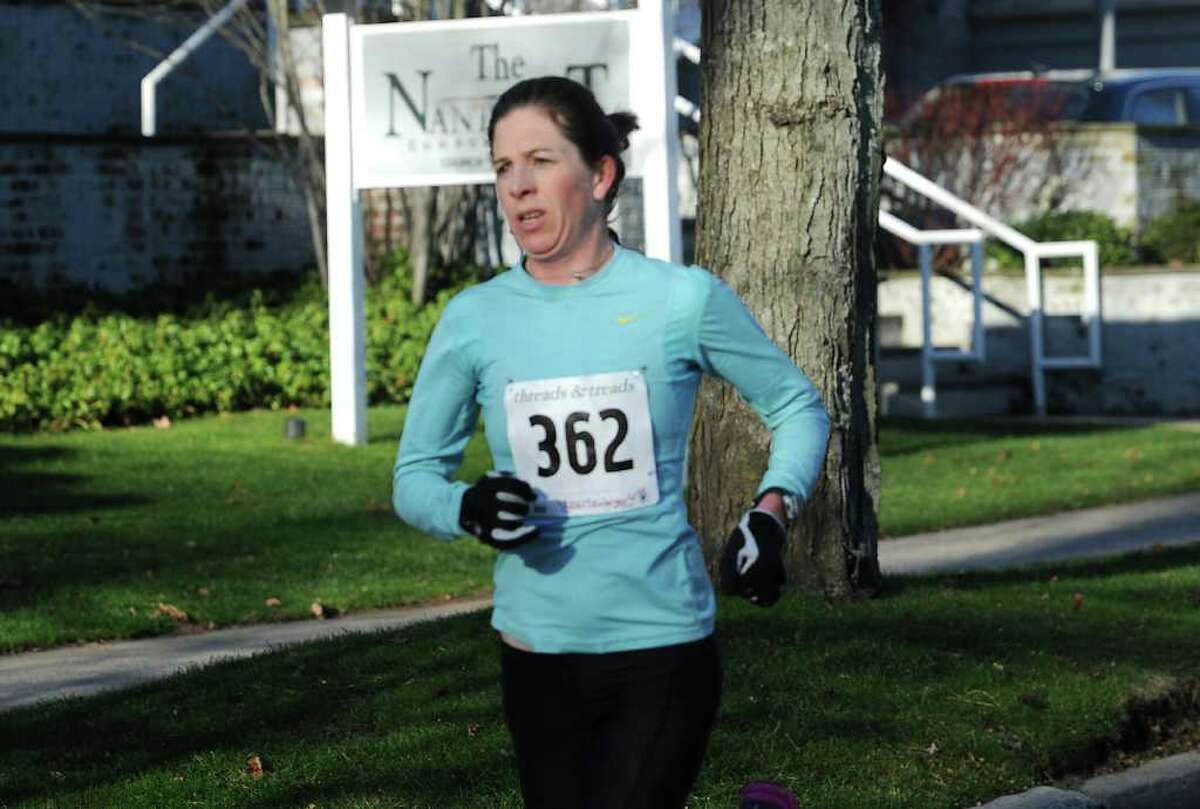 Sharon Lemberger, of Stamford, won the women's division of the three-mile Jingle Bell Jog, in Greenwich, Sunday, Dec. 11, 2011. The Jingle Bell Jog is the final event of the year in the Volvo of Stamford Greenwich Cup series of 10 events.