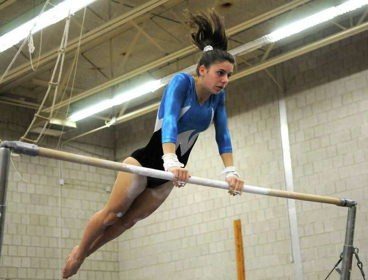 Staples' Anna Violette competes on the uneven bars last year. Violette was the Block S Team MVP and hopes to pick up where she left off last year.